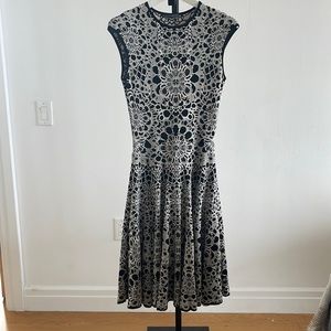 Alexander McQueen black and white print dress with flouncy skirt.